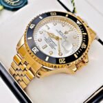 ROLEX SUBMARINER PULSO TRENZADO. Hombre. Dorado Fondo Blanco.