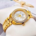 ROLEX BUTTERFLY. Mujer. Dorado.