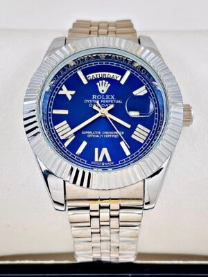 ROLEX PRESIDENCIAL NUMEROS ROMANOS. Hombre. Plateado Fondo Azul.