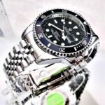 ROLEX SUBMARINER PULSO TRENZADO. Hombre. Plateado Fondo Negro.